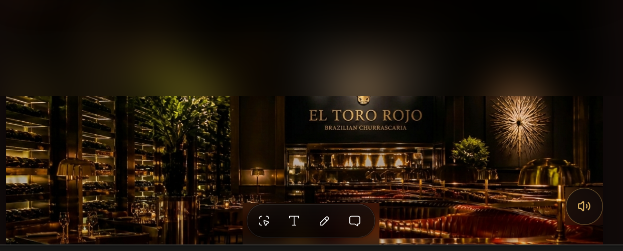 El Toro Rojo dining room with wine walls, brass lighting and open churrasco grill